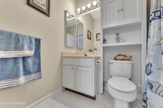 bathroom with toilet, tile patterned flooring, and vanity