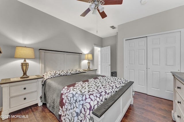 bedroom featuring dark hardwood / wood-style floors, a closet, and ceiling fan