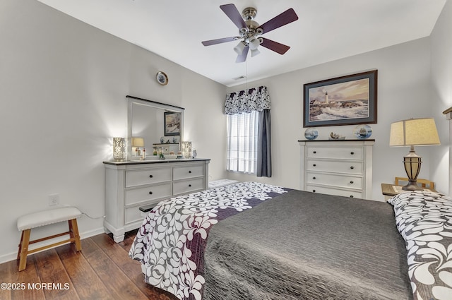 bedroom featuring ceiling fan and dark hardwood / wood-style flooring