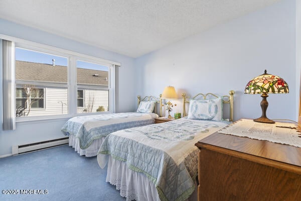 bedroom featuring lofted ceiling, carpet floors, a textured ceiling, and baseboard heating