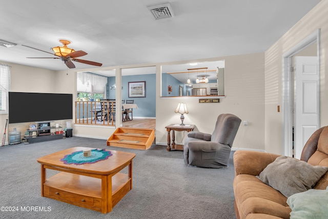 living room featuring ceiling fan and carpet floors