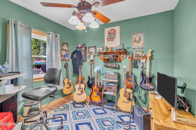 home office with ceiling fan and hardwood / wood-style floors