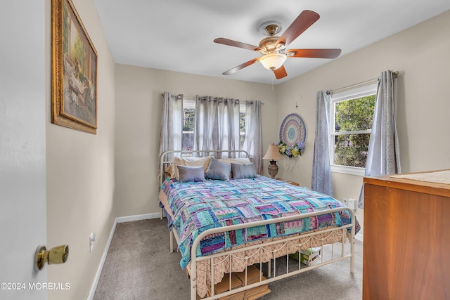 bedroom with ceiling fan and carpet floors