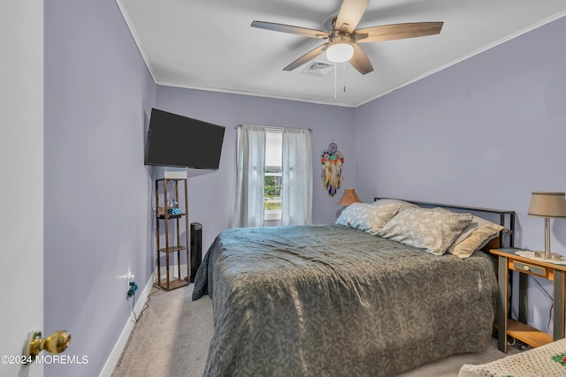 bedroom featuring ceiling fan, light colored carpet, and crown molding