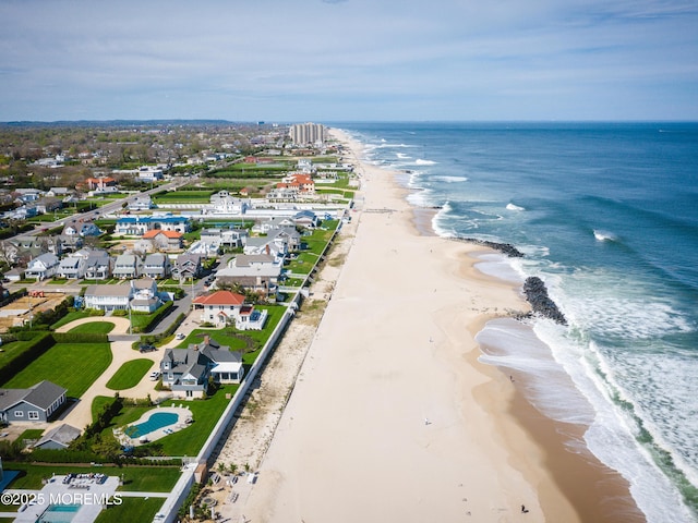 bird's eye view with a view of the beach and a water view