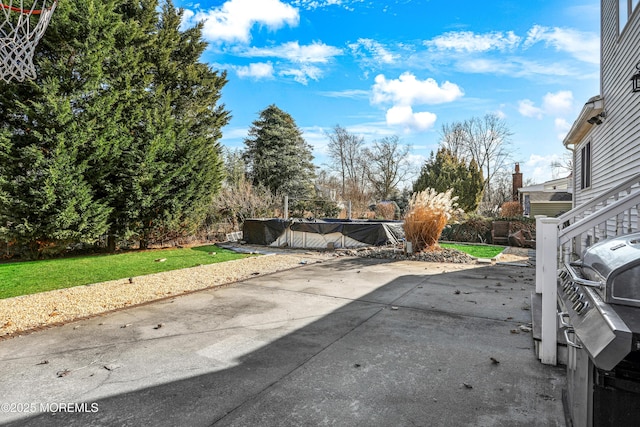 view of patio with a pool