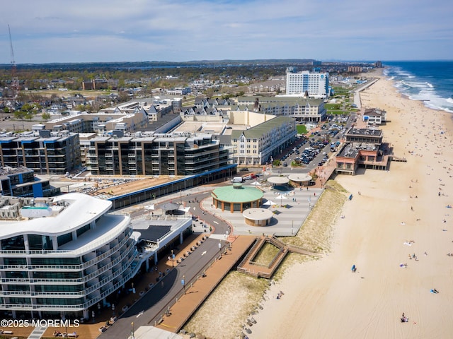 aerial view featuring a view of the beach and a water view