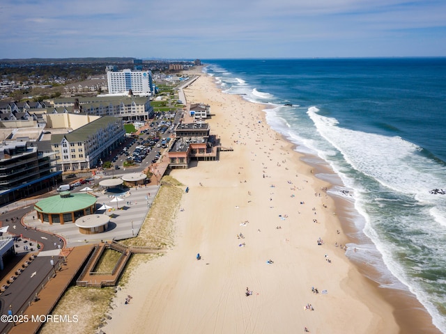 drone / aerial view with a view of the beach and a water view