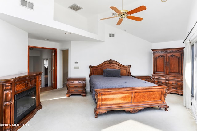 carpeted bedroom featuring high vaulted ceiling and ceiling fan