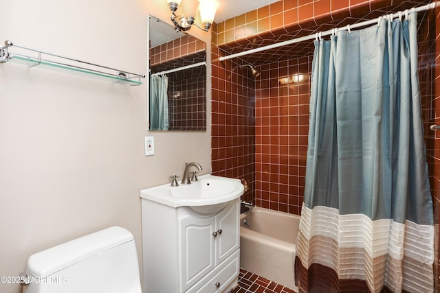 full bathroom with vanity, shower / tub combo, and toilet