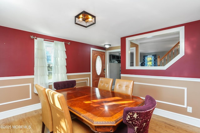 dining space with hardwood / wood-style floors