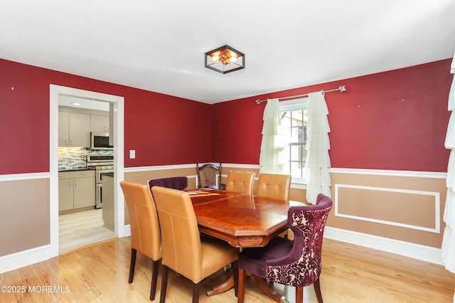 dining area with light hardwood / wood-style floors