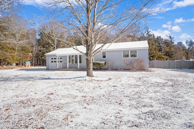 view of snow covered back of property