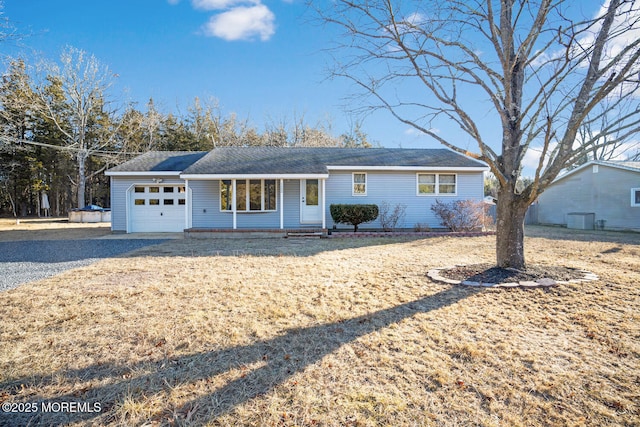 ranch-style home featuring a garage and covered porch