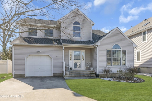 view of front property with a garage and a front yard