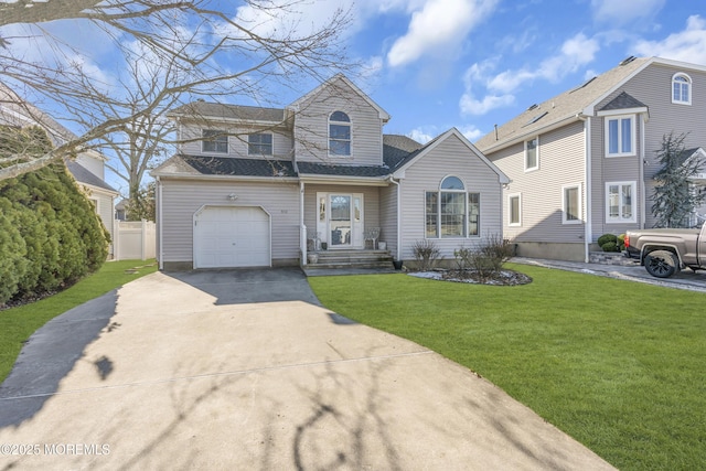 front of property with a garage and a front lawn