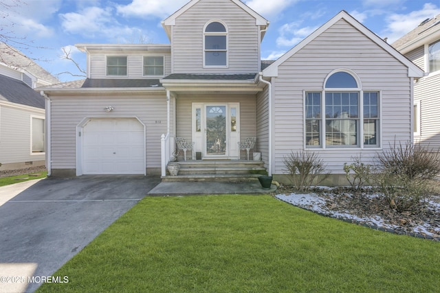 front of property with a garage and a front yard