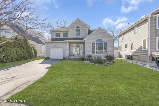 front facade featuring a garage and a front lawn