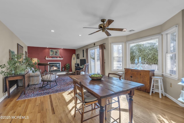 dining room featuring ceiling fan and light wood-type flooring