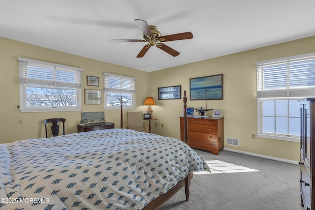 bedroom featuring light colored carpet and ceiling fan