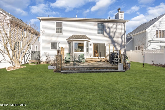 rear view of house featuring a yard and a patio area