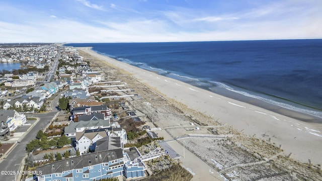 aerial view featuring a view of the beach and a water view