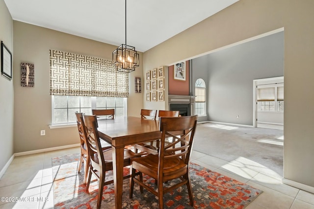 tiled dining space with an inviting chandelier