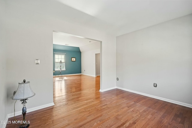 empty room featuring wood-type flooring