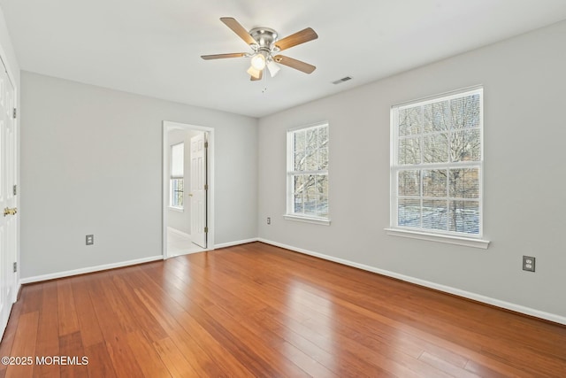 spare room featuring ceiling fan and hardwood / wood-style floors