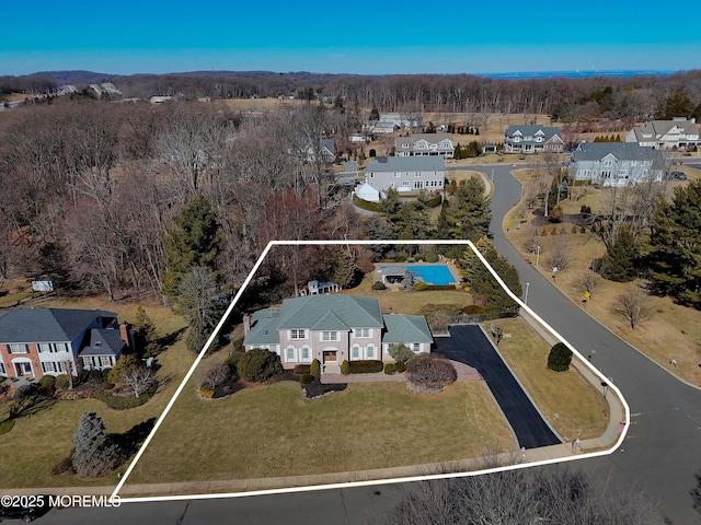 birds eye view of property with a residential view