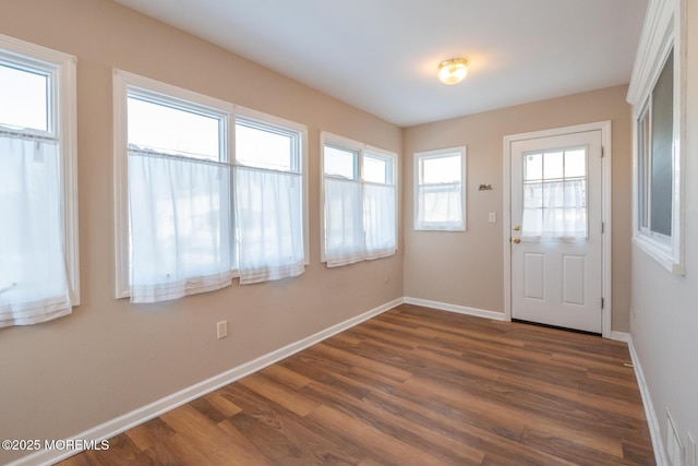 doorway to outside with dark hardwood / wood-style flooring