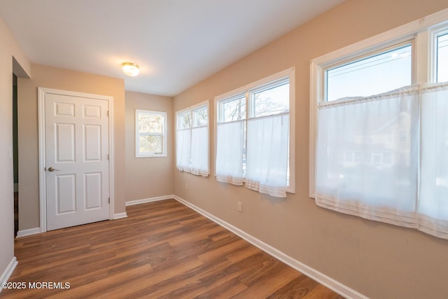 interior space with dark hardwood / wood-style flooring