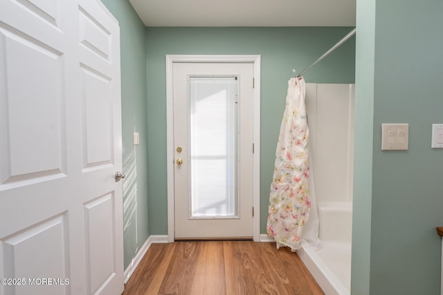 doorway with wood-type flooring