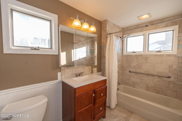 full bathroom with vanity, toilet, tile patterned flooring, and shower / bath combo