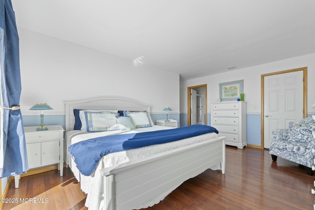 bedroom featuring dark hardwood / wood-style floors