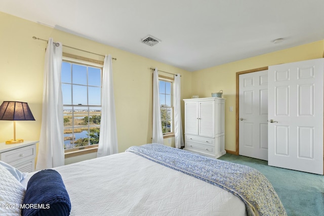 bedroom featuring light colored carpet