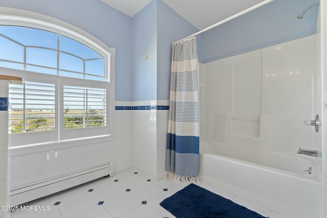 bathroom featuring shower / tub combo with curtain and a baseboard radiator