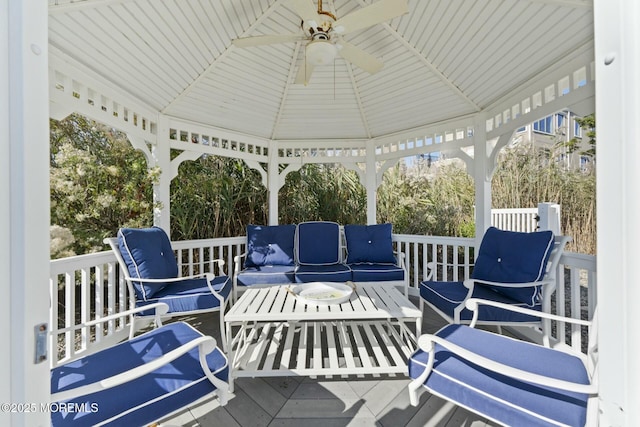 exterior space featuring ceiling fan