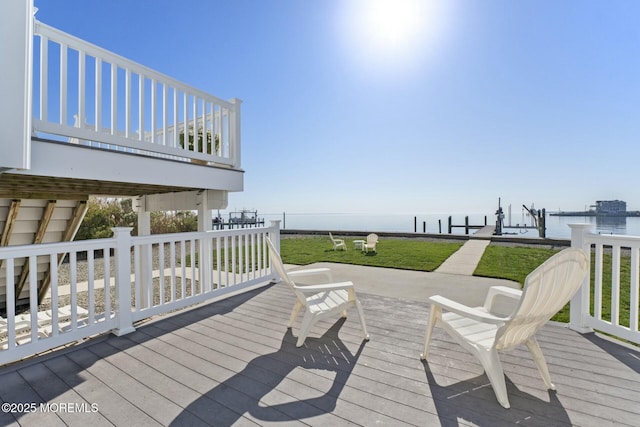 wooden deck featuring a water view