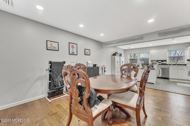 dining room featuring light hardwood / wood-style floors and sink