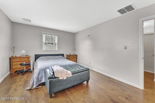 bedroom with light wood-type flooring