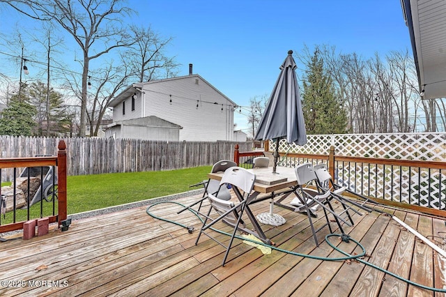 wooden terrace with a yard