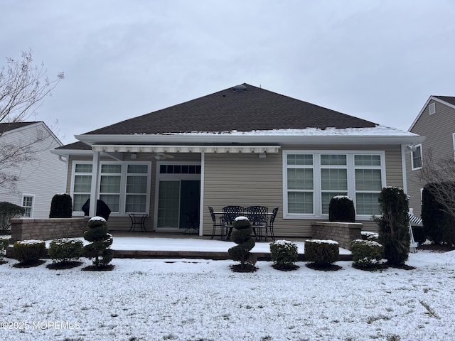 view of snow covered house