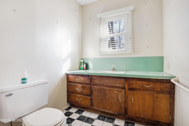 bathroom with toilet and vanity