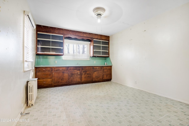 kitchen featuring ceiling fan and radiator