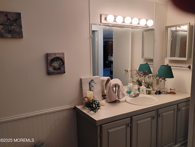 bathroom with vanity and wainscoting