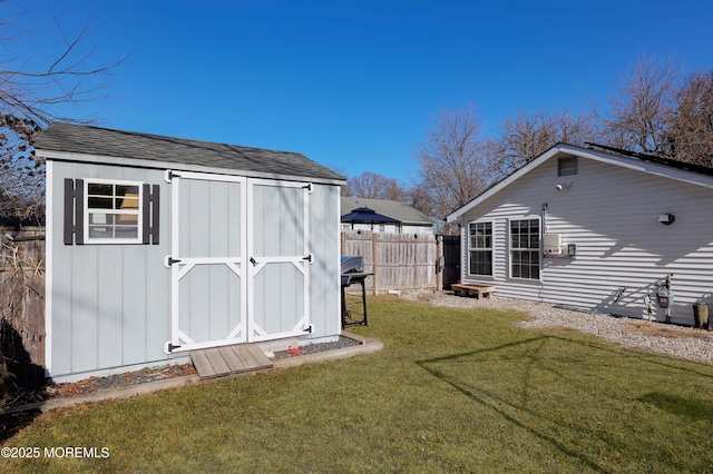 view of outbuilding featuring a yard