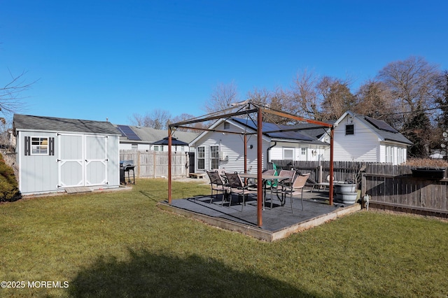 view of yard featuring a gazebo, a storage unit, and a patio area