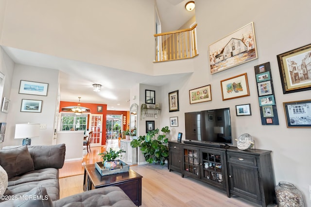 66 Banyan Blvd, Holmdel, NJ 07733 - living area featuring light wood-style floors and a chandelier
