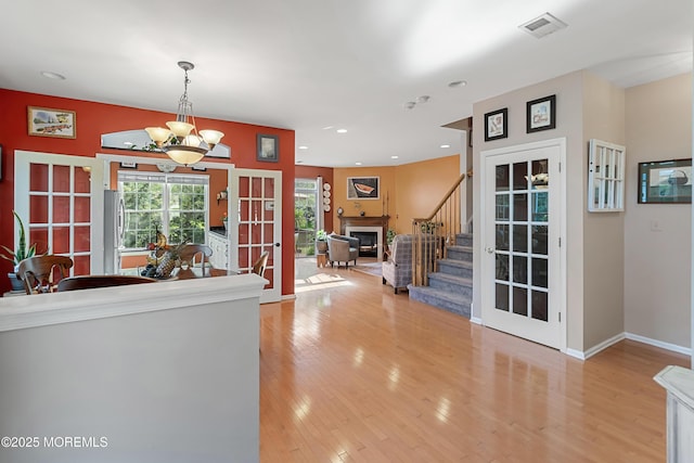 66 Banyan Blvd, Holmdel, NJ 07733 - corridor featuring french doors, stairway, light wood-style floors, a chandelier, and recessed lighting